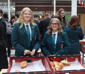 Emma Craig and Zara Colvin selling croissants at break time in school.