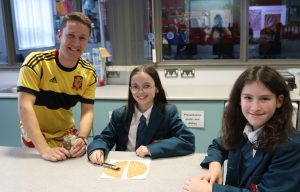 Teacher Mr A McAuley pictured with Scarlett McBride and Grace McElroy.